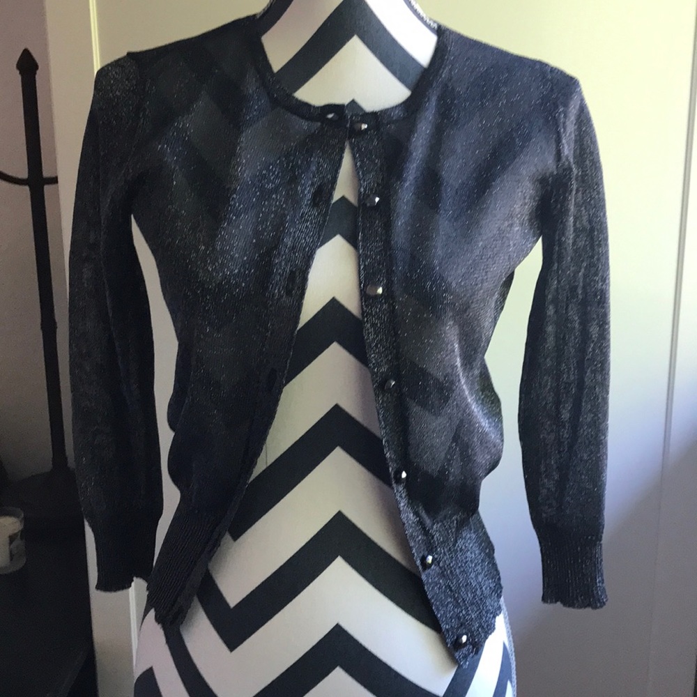 Glimmer sweater stretch on waist and arms.